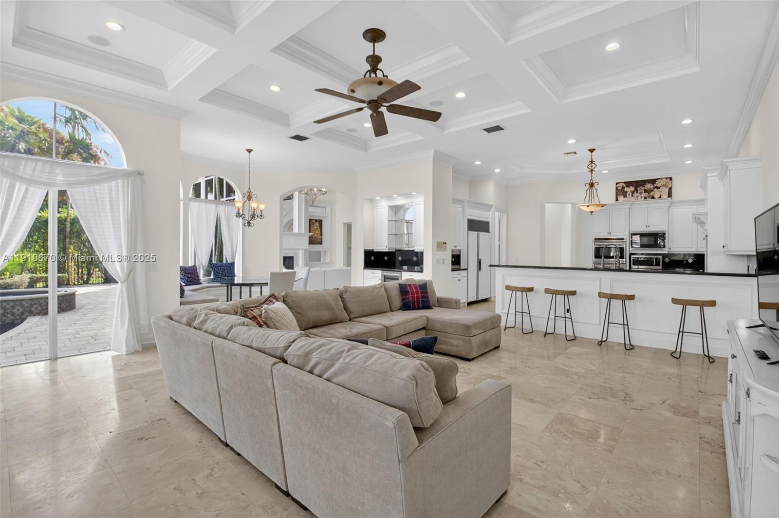 9597 Bridgebrook Drive Boca Raton, FL 33496 - Photo 21 of 88 a living room with furniture and a large window