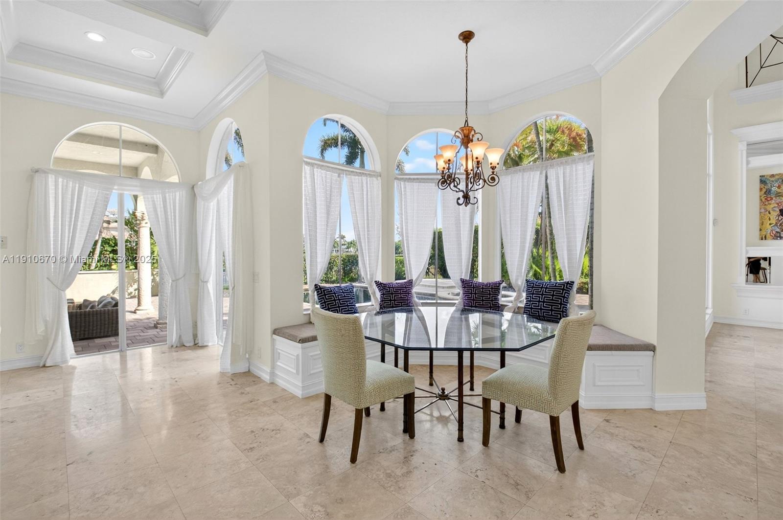 9597 Bridgebrook Drive Boca Raton, FL 33496 - Photo 23 of 88 a view of a dining room with furniture and chandelier