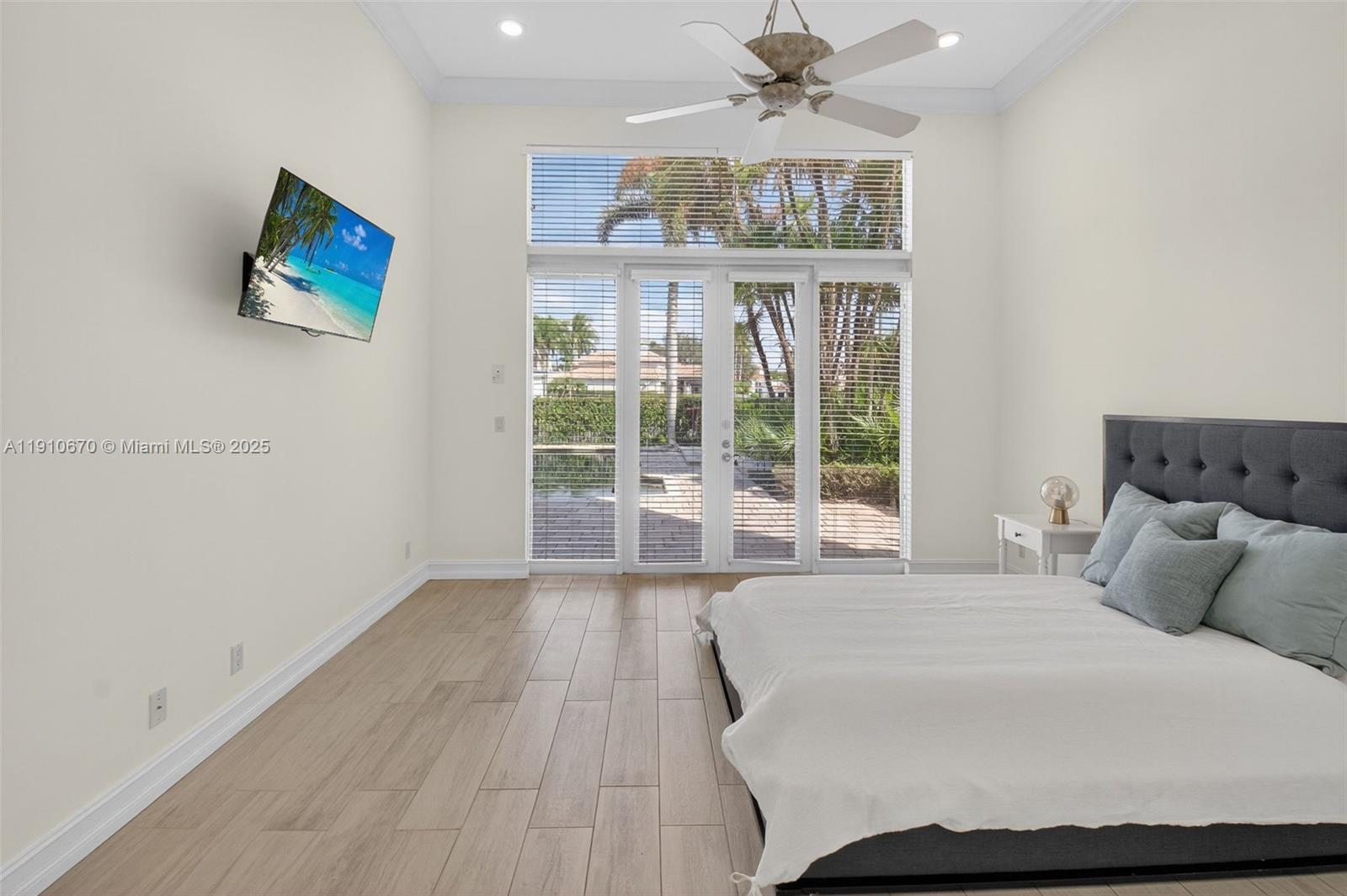 9597 Bridgebrook Drive Boca Raton, FL 33496 - Photo 26 of 88 a bedroom with a large bed and a window