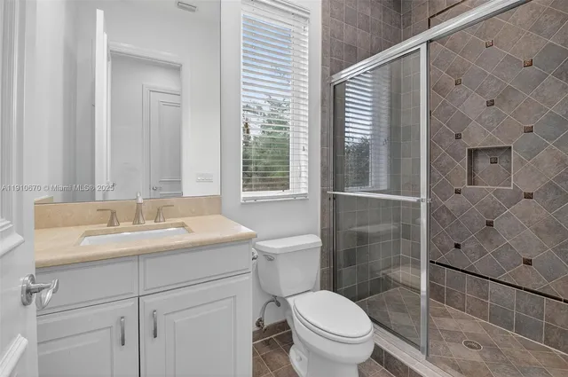 a view of a lake with houses in the back