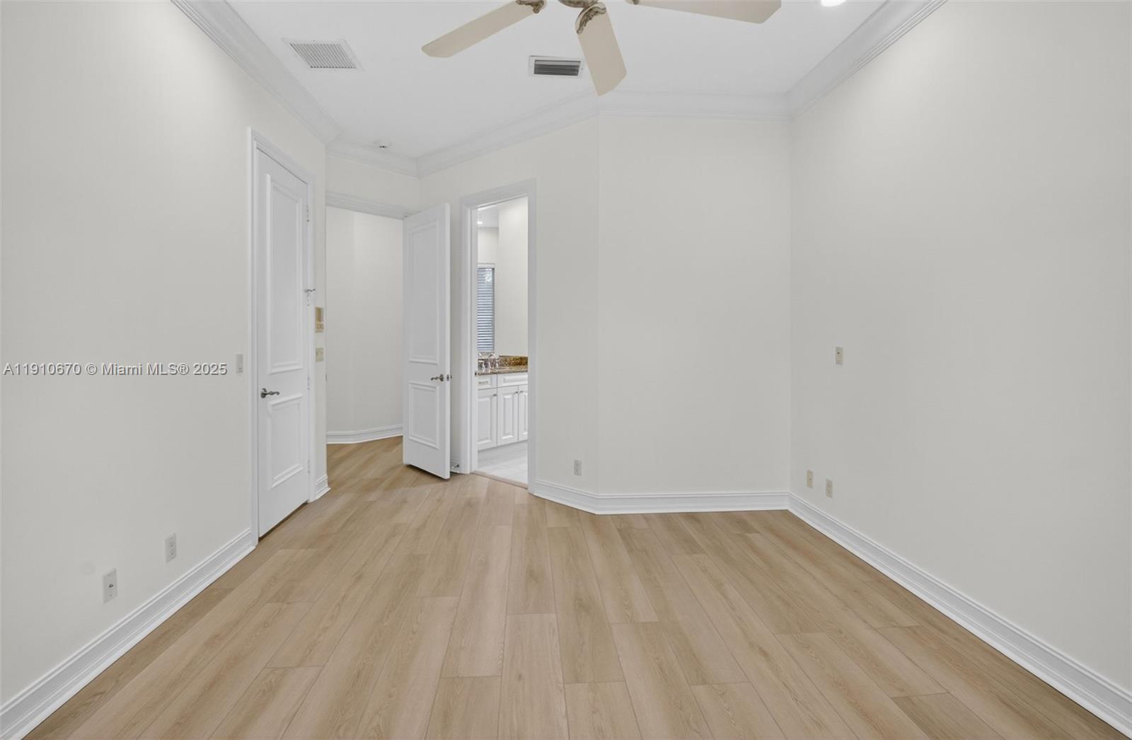 9597 Bridgebrook Drive Boca Raton, FL 33496 - Photo 36 of 88 a view of a room with wooden floor and a ceiling fan