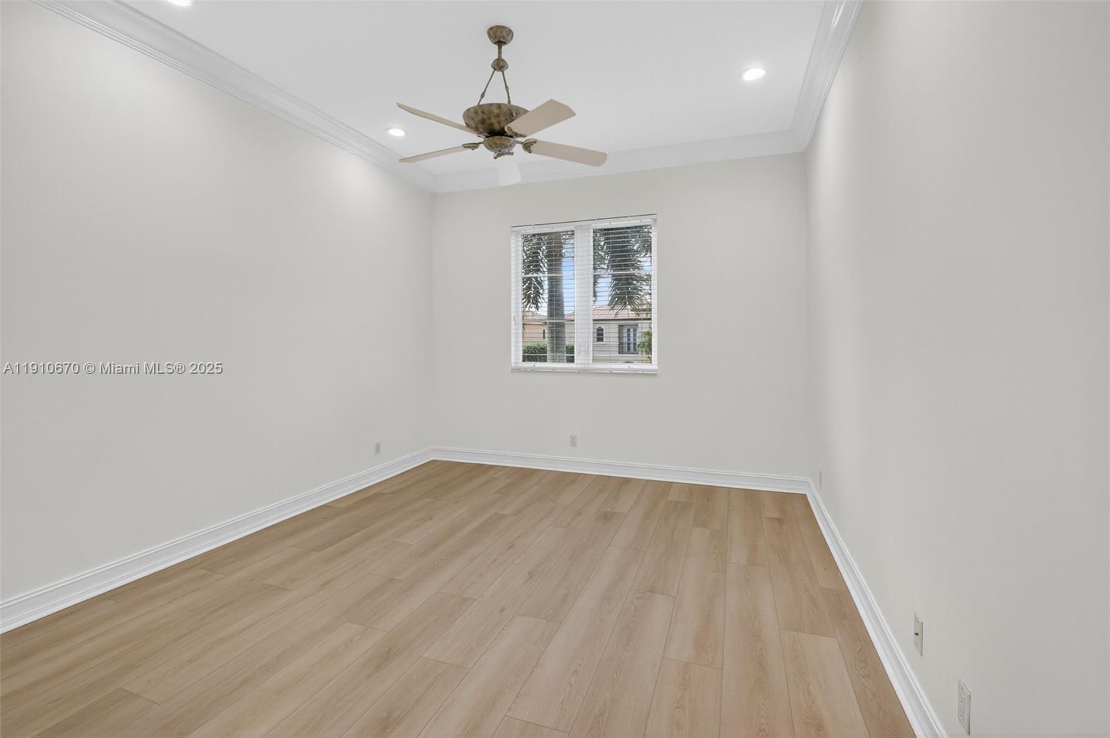 9597 Bridgebrook Drive Boca Raton, FL 33496 - Photo 37 of 88 wooden floor in an empty room with a window