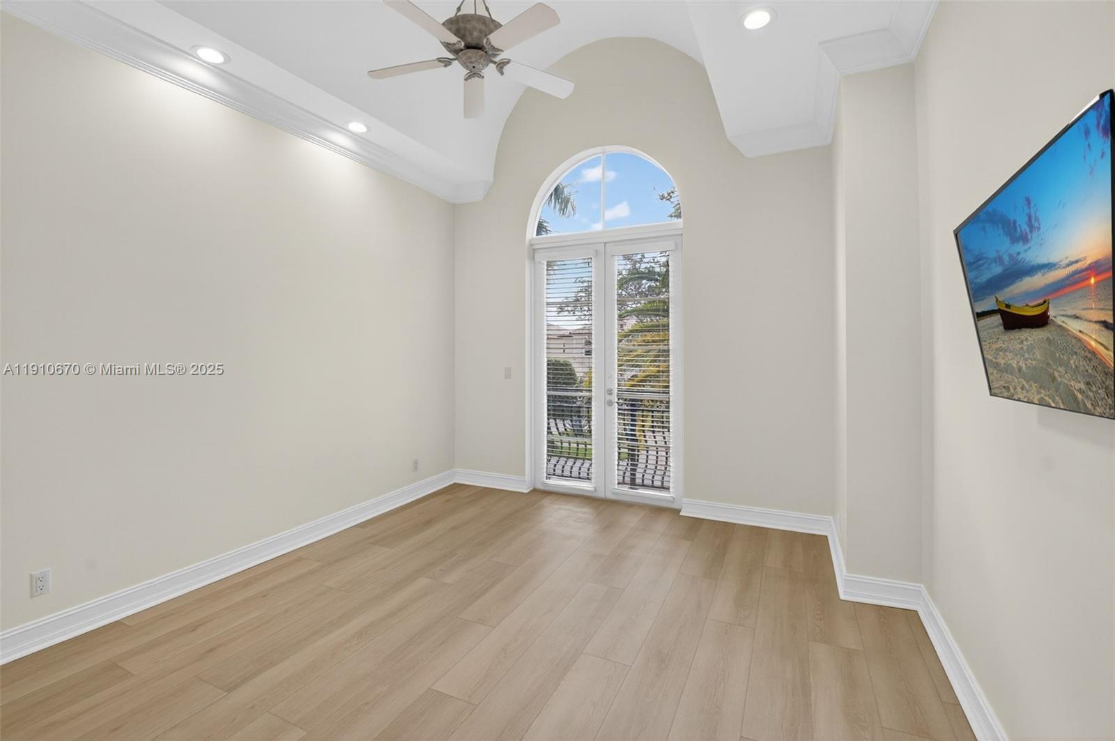 9597 Bridgebrook Drive Boca Raton, FL 33496 - Photo 40 of 88 wooden floor in an empty room with a window