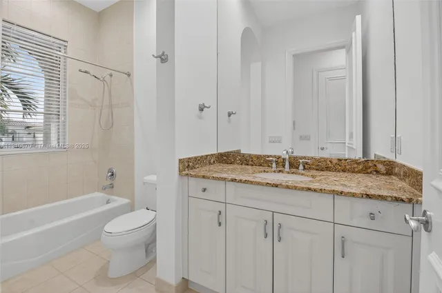 an aerial view of a house with a lake view