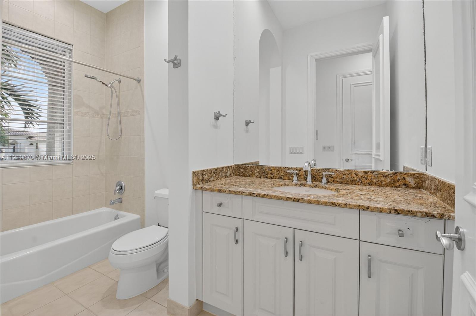 9597 Bridgebrook Drive Boca Raton, FL 33496 - Photo 41 of 88 a bathroom with a granite countertop sink toilet and shower