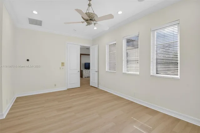 an aerial view of a house with a yard and lake view