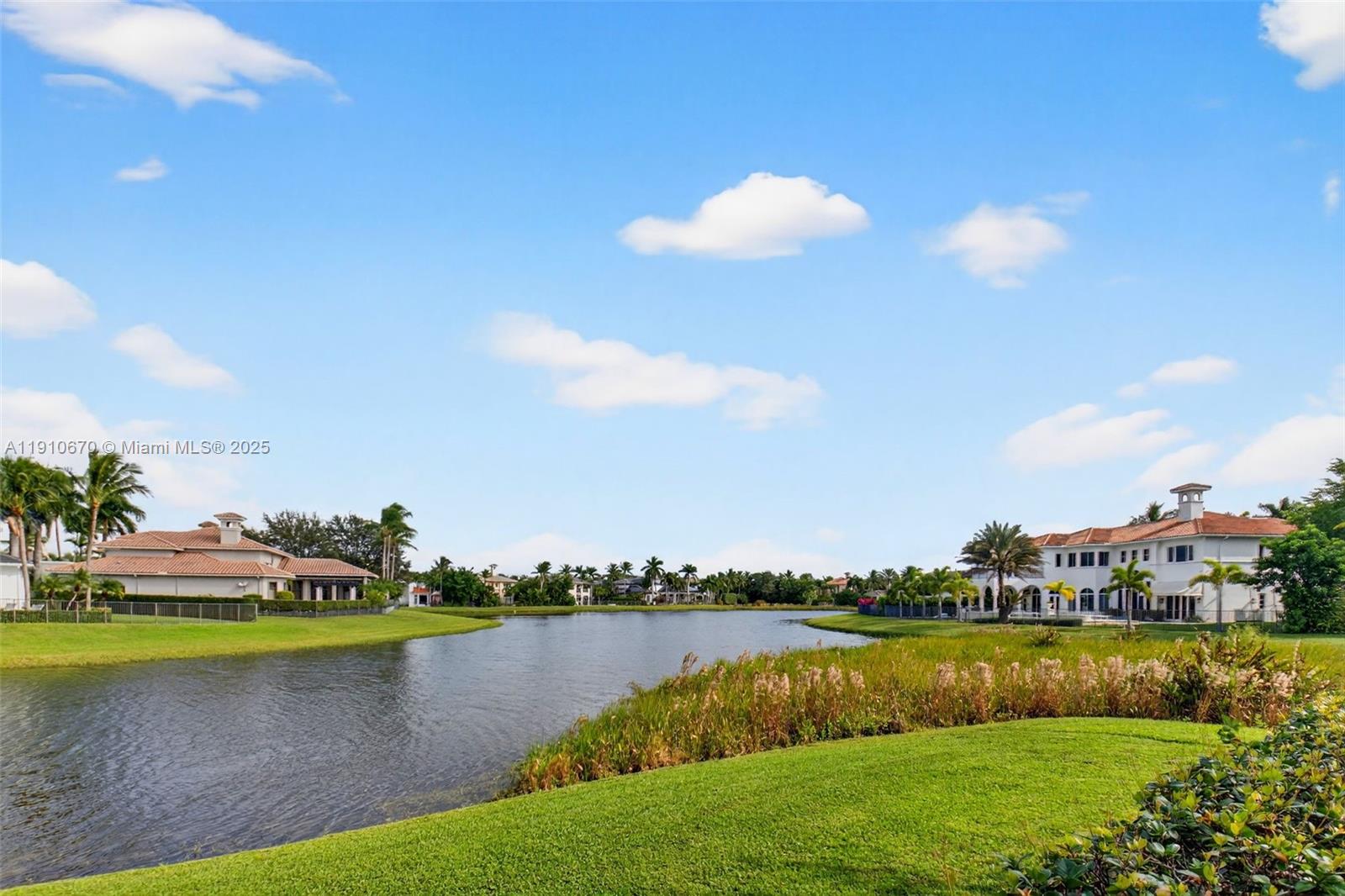 9597 Bridgebrook Drive Boca Raton, FL 33496 - Photo 56 of 88 a view of a lake with houses in the back