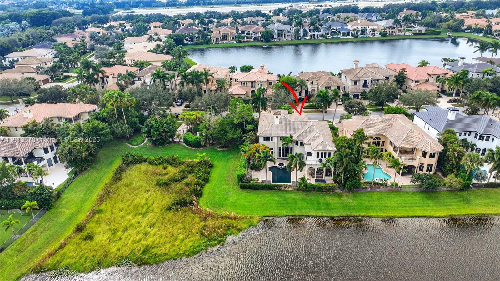 9597 Bridgebrook Drive Boca Raton, FL 33496 - Photo 72 of 88 an aerial view of a house with a yard and lake view