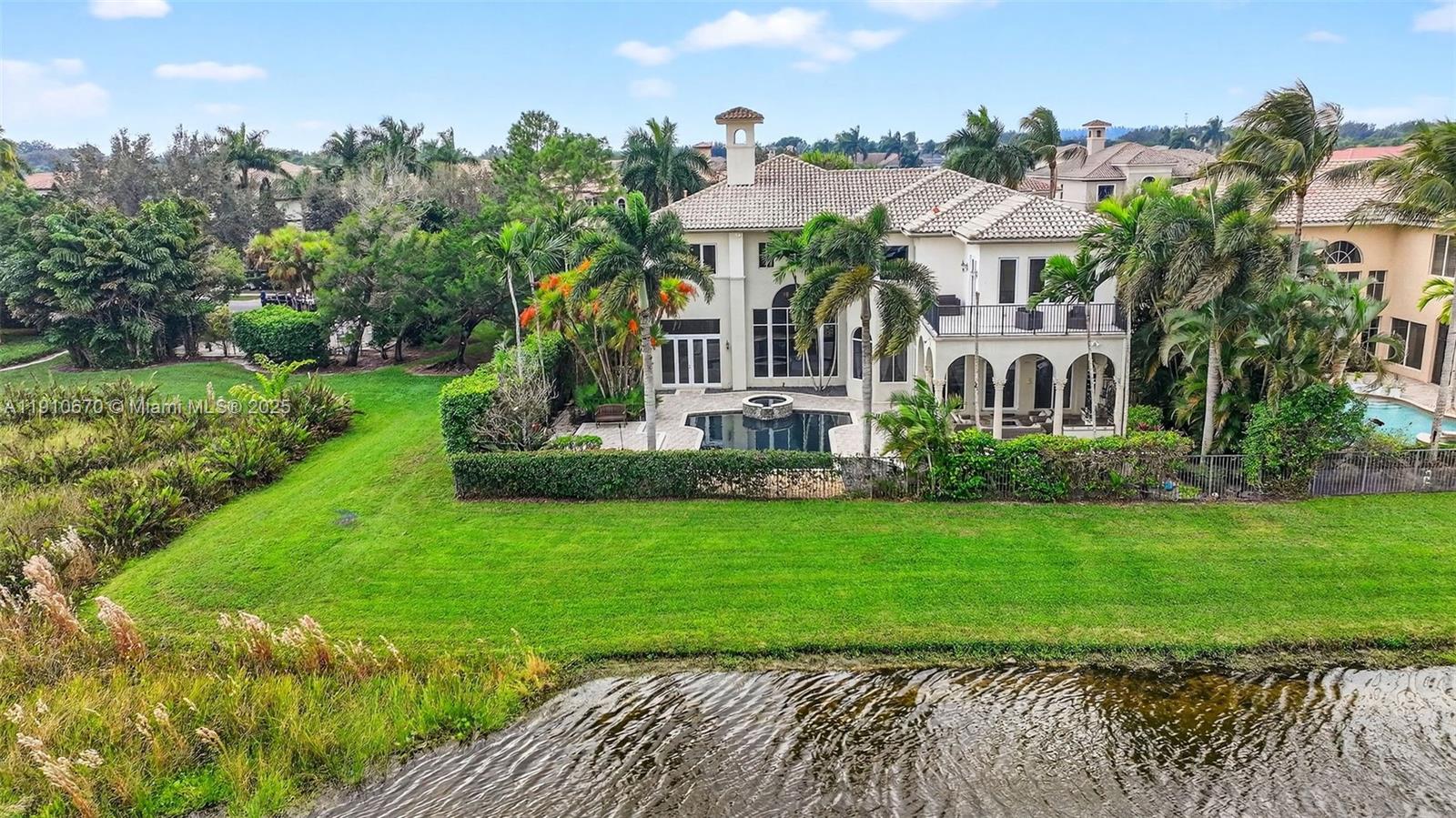 9597 Bridgebrook Drive Boca Raton, FL 33496 - Photo 73 of 88 a front view of a house with a yard
