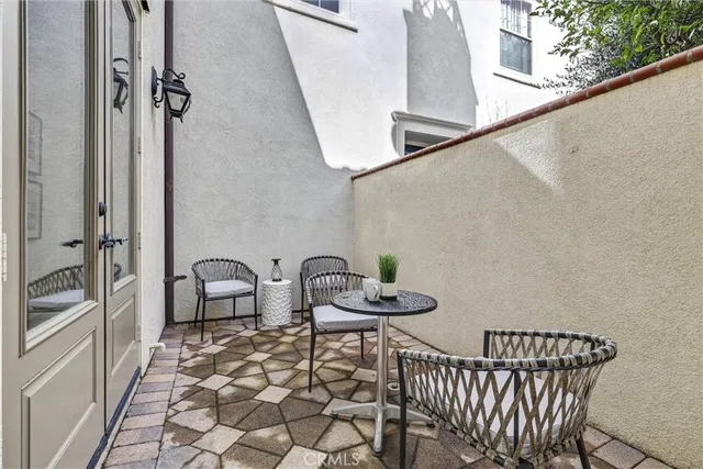 a view of a balcony with chairs