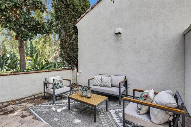 a outdoor living space with furniture and a potted plant