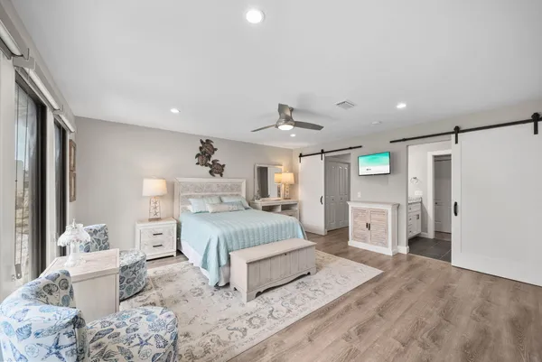 a spacious bedroom with a large bed and a couch