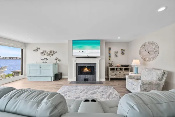 a spacious bedroom with a bed and a fireplace