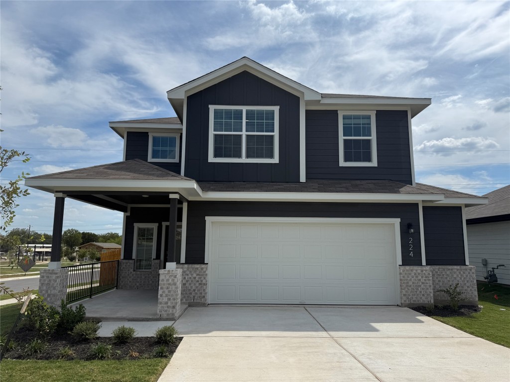 224 Inks Lane Kyle, TX 78640 - Photo 1 of 13 a front view of a house with a yard