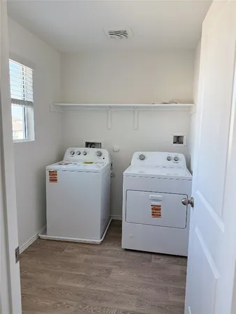 a utility room with washer and dryer