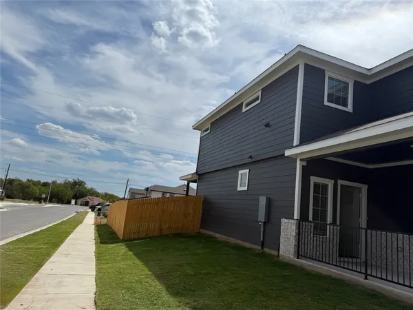 a backyard of a house with lots of green space