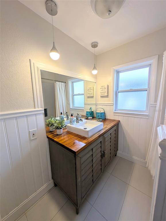 1460 Ruth Road Dunedin, FL 34698 - Photo 11 of 27 a kitchen with stainless steel appliances granite countertop a sink and a refrigerator