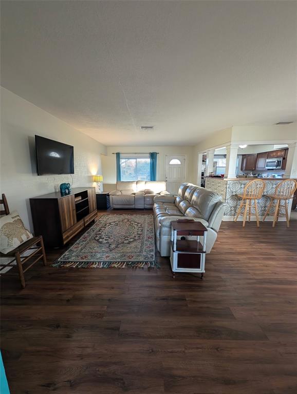 1460 Ruth Road Dunedin, FL 34698 - Photo 18 of 27 a living room with furniture and a flat screen tv