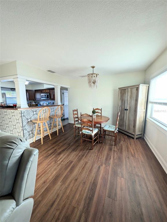 1460 Ruth Road Dunedin, FL 34698 - Photo 9 of 27 a living room with furniture and a wooden floor