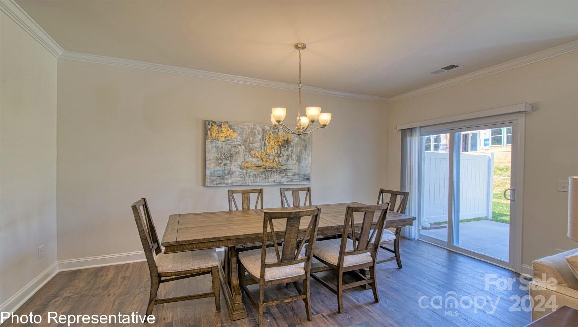 538 Wheatfield Road Fletcher, NC 28732 - Photo 23 of 44 a view of a dining room with furniture window and wooden floor