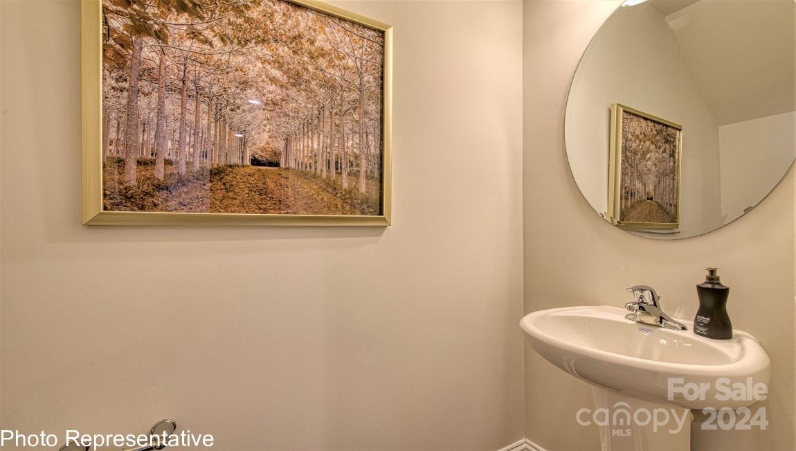 538 Wheatfield Road Fletcher, NC 28732 - Photo 24 of 44 a bathroom with a sink and a mirror