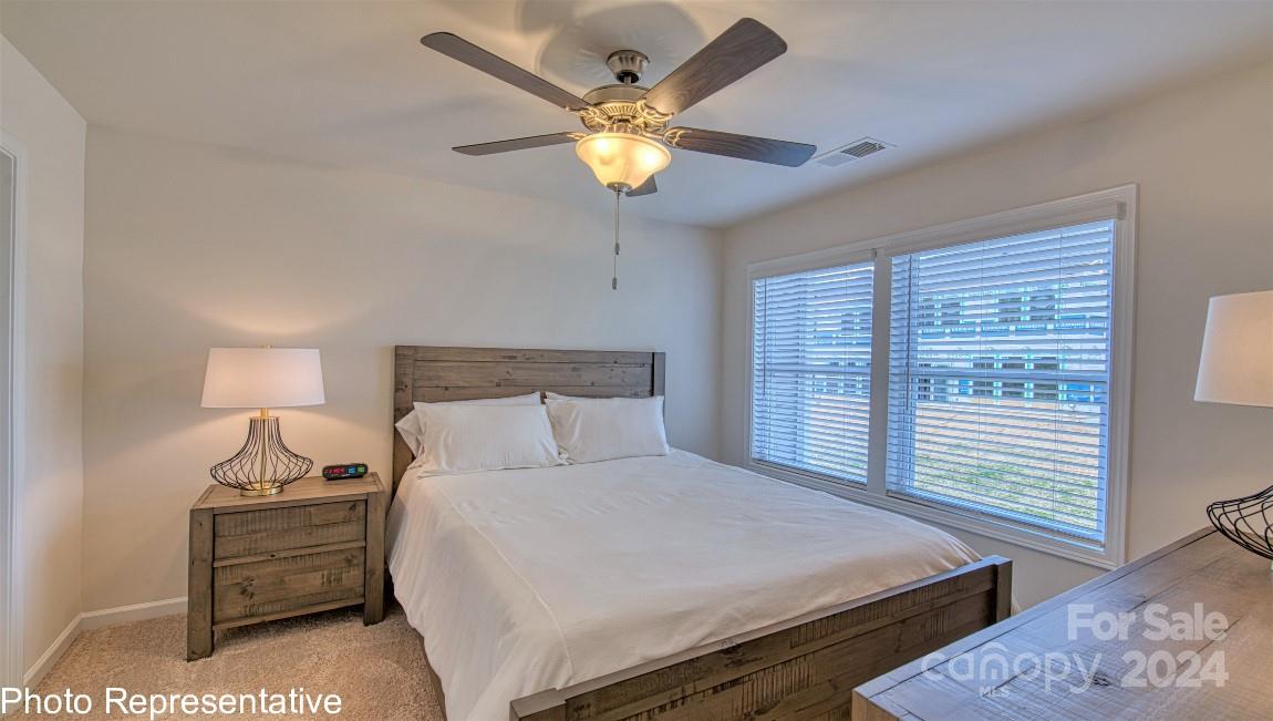 538 Wheatfield Road Fletcher, NC 28732 - Photo 35 of 44 a bedroom with a bed and window