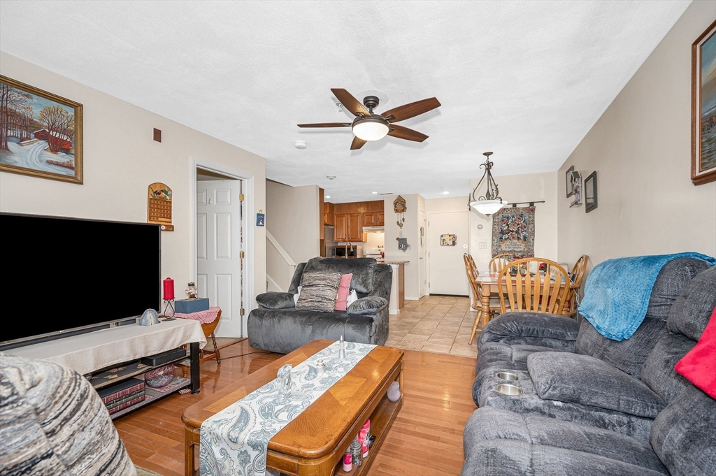 39 Broadway, Unit 305 Malden, MA 02148 - Photo 13 of 36 a living room with furniture and a flat screen tv