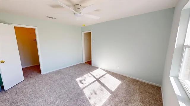 a view of empty room with windows