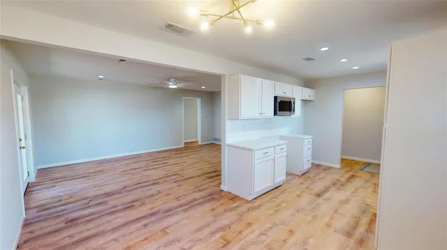a view of kitchen and wooden floor