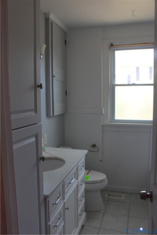 710 Colonial Avenue Colonial Heights, VA 23834 - Photo 12 of 14 a bathroom with a sink toilet and window