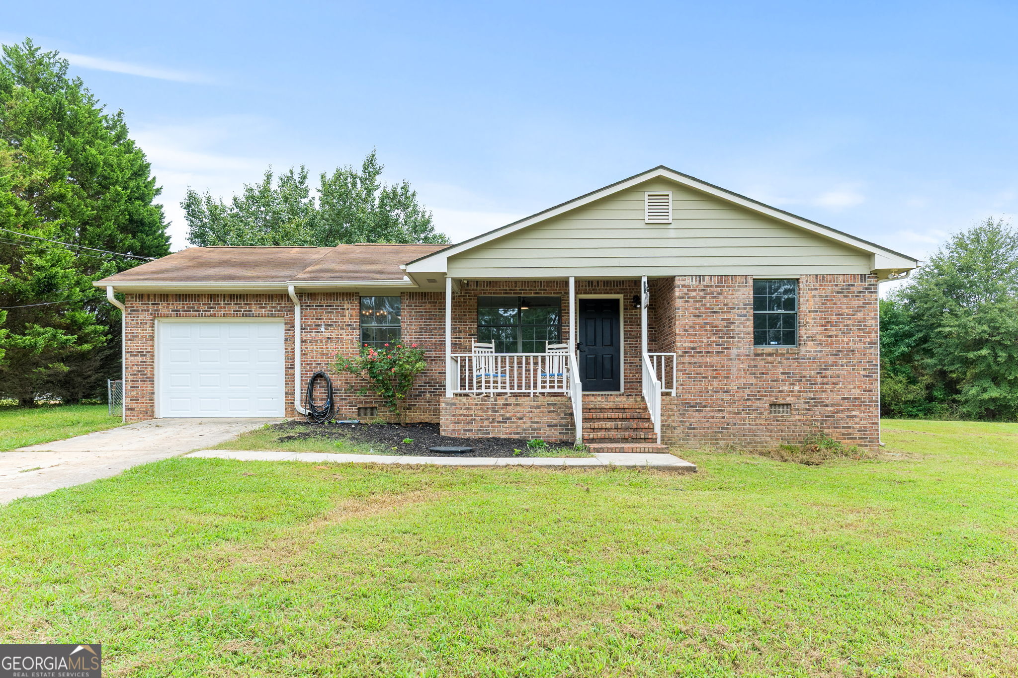 243 Covington Road Griffin, GA 30223 - Photo 1 of 1 a front view of a house with a yard