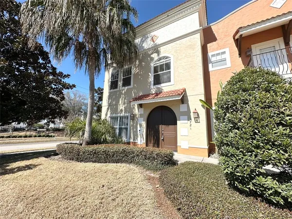 a front view of a house with a yard