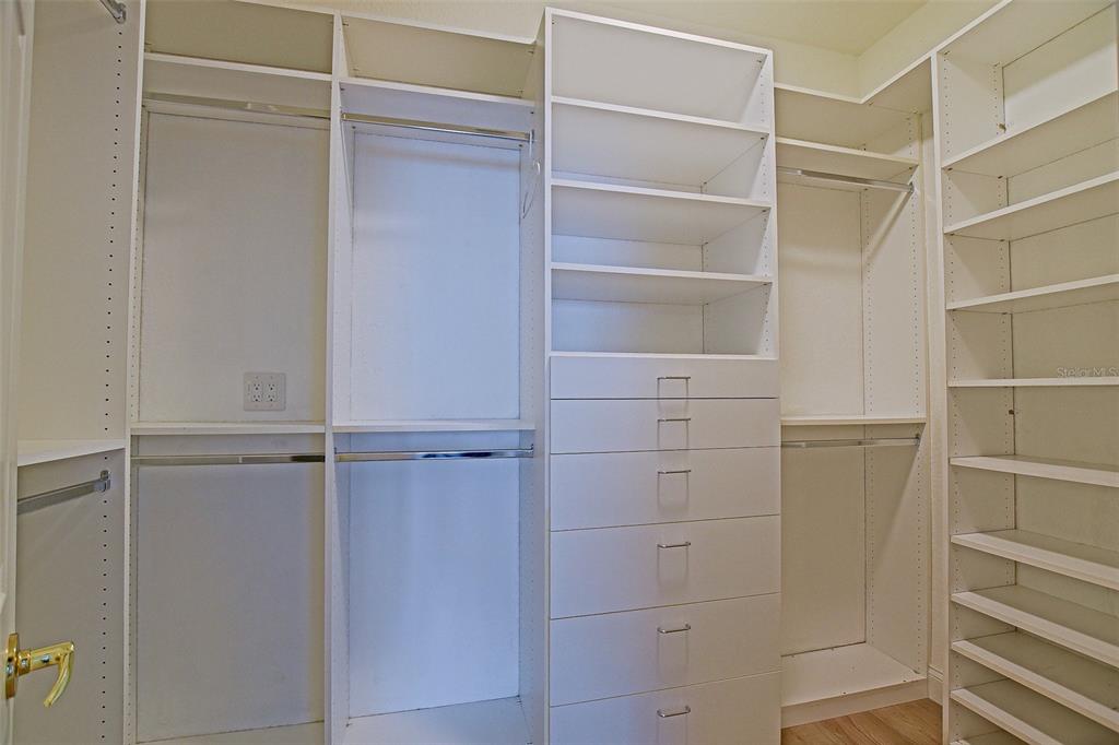 9203 Southeast 130th Loop Summerfield, FL 34491 - Photo 50 of 90 a view of walk in closet with empty racks