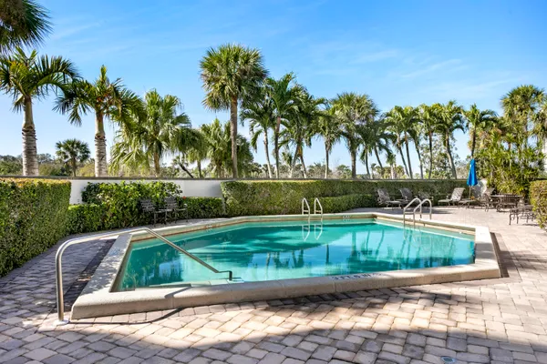 a view of a swimming pool with a lounge chair