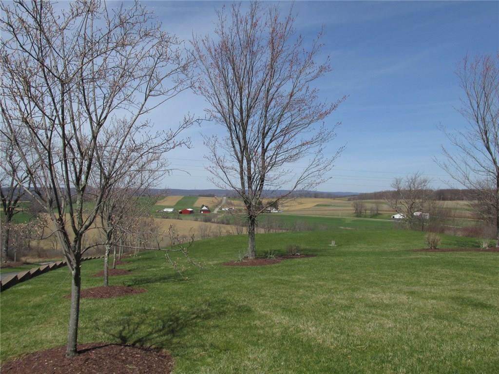 243 Baer Ridge Road Somerset, PA 15501 - Photo 11 of 25 Incredible countryside views! The drive way is black topped and wide enough for 2 vehicles to pass! You can see the decorative block retaining wall. A sand mound system was installed in 1989.