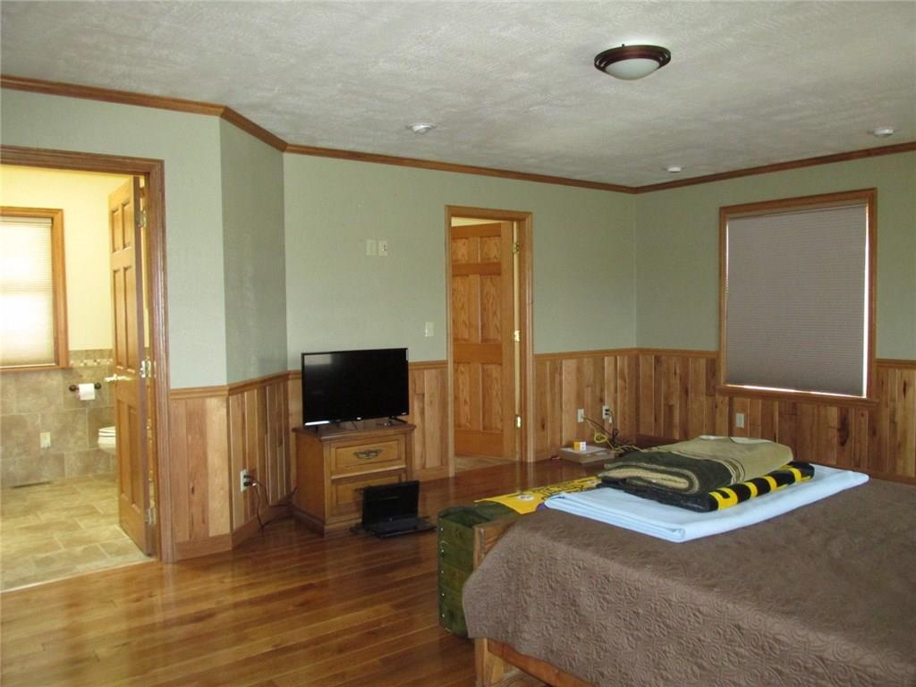 243 Baer Ridge Road Somerset, PA 15501 - Photo 13 of 25 We just came into the master bedroom from the door on the right. The left side door is the master bathroom.