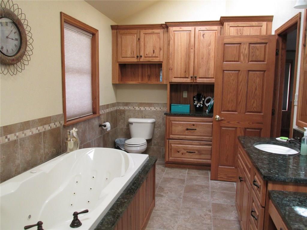 243 Baer Ridge Road Somerset, PA 15501 - Photo 15 of 25 Other side with better picture of the jetted tub. The half bath that opens up to the pool is behind the toilet wall.