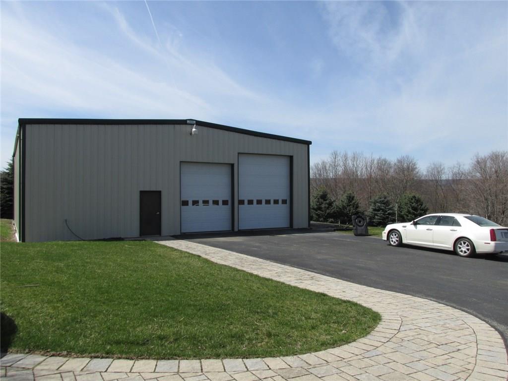 243 Baer Ridge Road Somerset, PA 15501 - Photo 3 of 25 It is an insulated Olympic Steel Building that's 50x60. The garage door on the left is 10x12 and the one on the right 12x14. We will take a look inside after we walk through the home.
