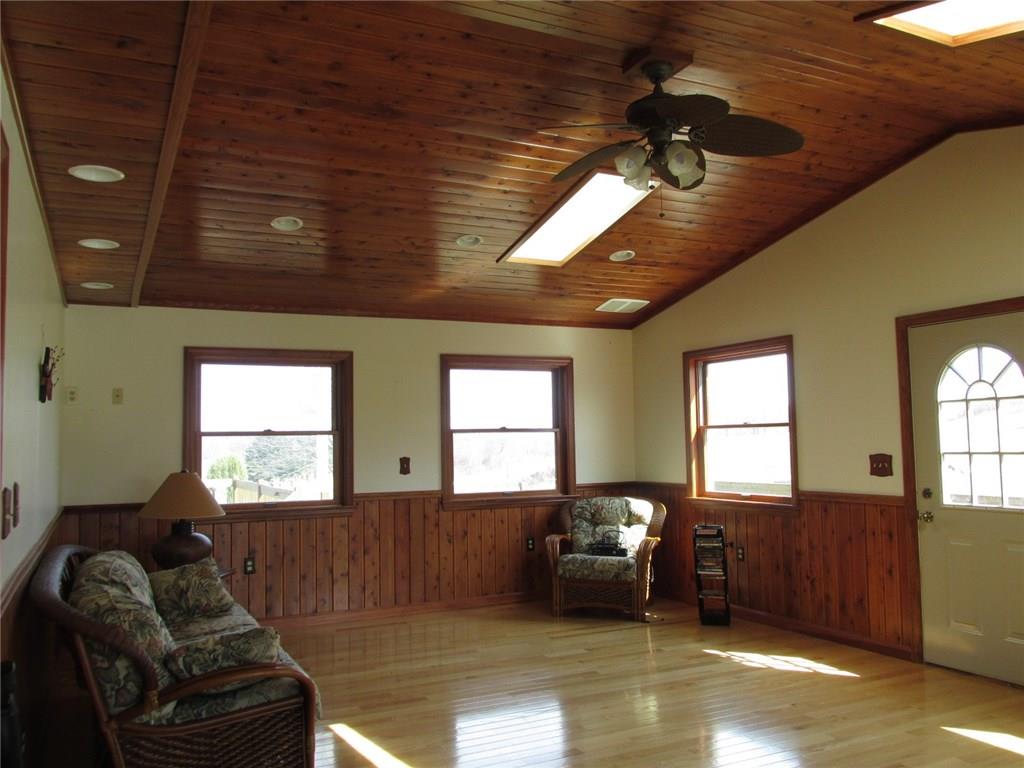 243 Baer Ridge Road Somerset, PA 15501 - Photo 7 of 25 The door opens up to a back deck. There are skylights on the left and right sides of the ceiling fan with light. Have you noticed the wood floors, ceilings, and wainscoting? Recessed lights allow you to determine the brightness.
