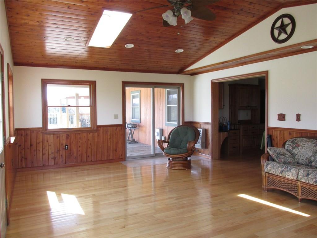 243 Baer Ridge Road Somerset, PA 15501 - Photo 8 of 25 Here is the other side of the living room. The sliding door opens up to the outdoor summer pool. Off to the right is the kitchen.