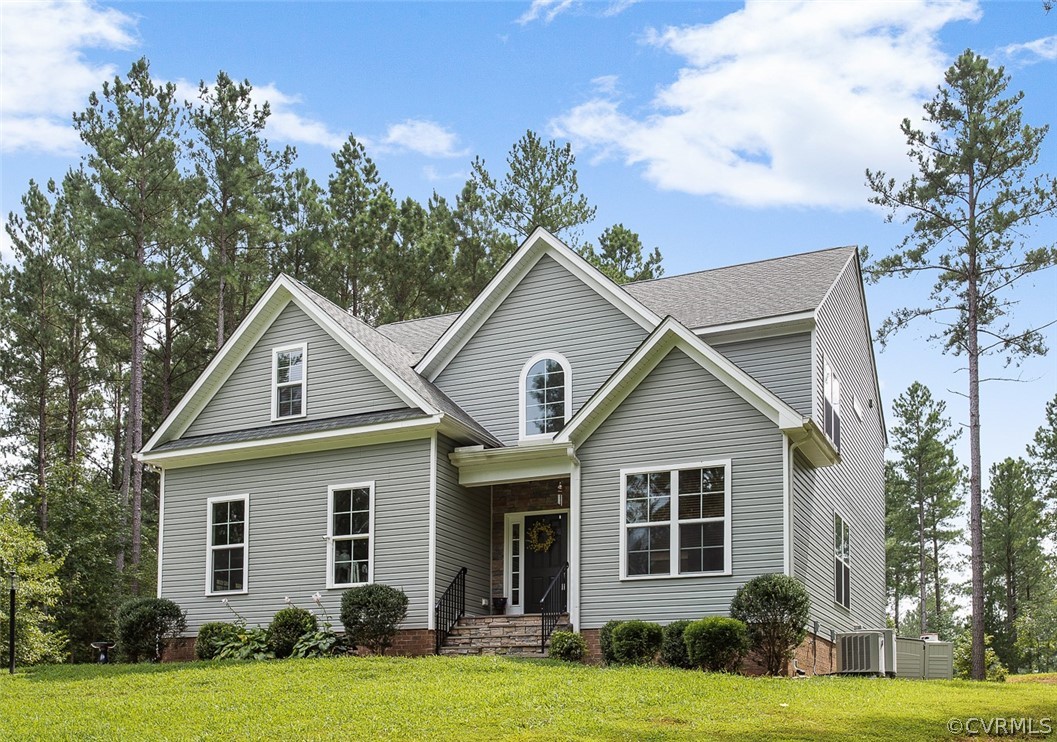 12011 Winterpock Road Chesterfield, VA 23838 - Photo 3 of 33 a front view of a house with a yard