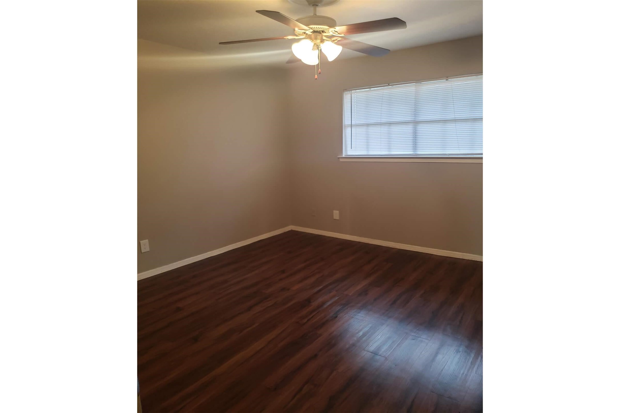 1212 Hampshire Lane, Unit 2371 Richardson, TX 75080 - Photo 15 of 50 a view of a room with wooden floor and a ceiling fan