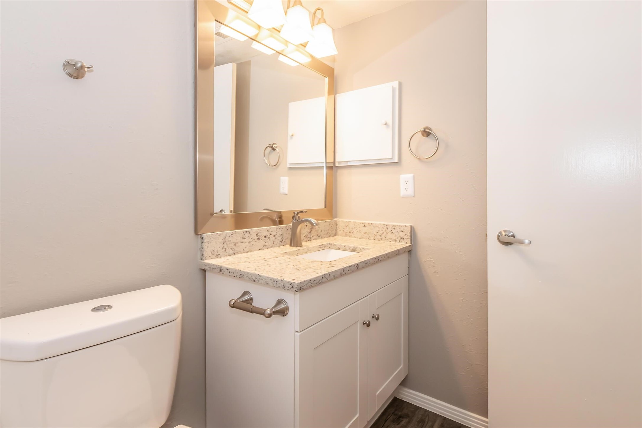 1212 Hampshire Lane, Unit 2371 Richardson, TX 75080 - Photo 30 of 50 a bathroom with a sink a toilet and vanity