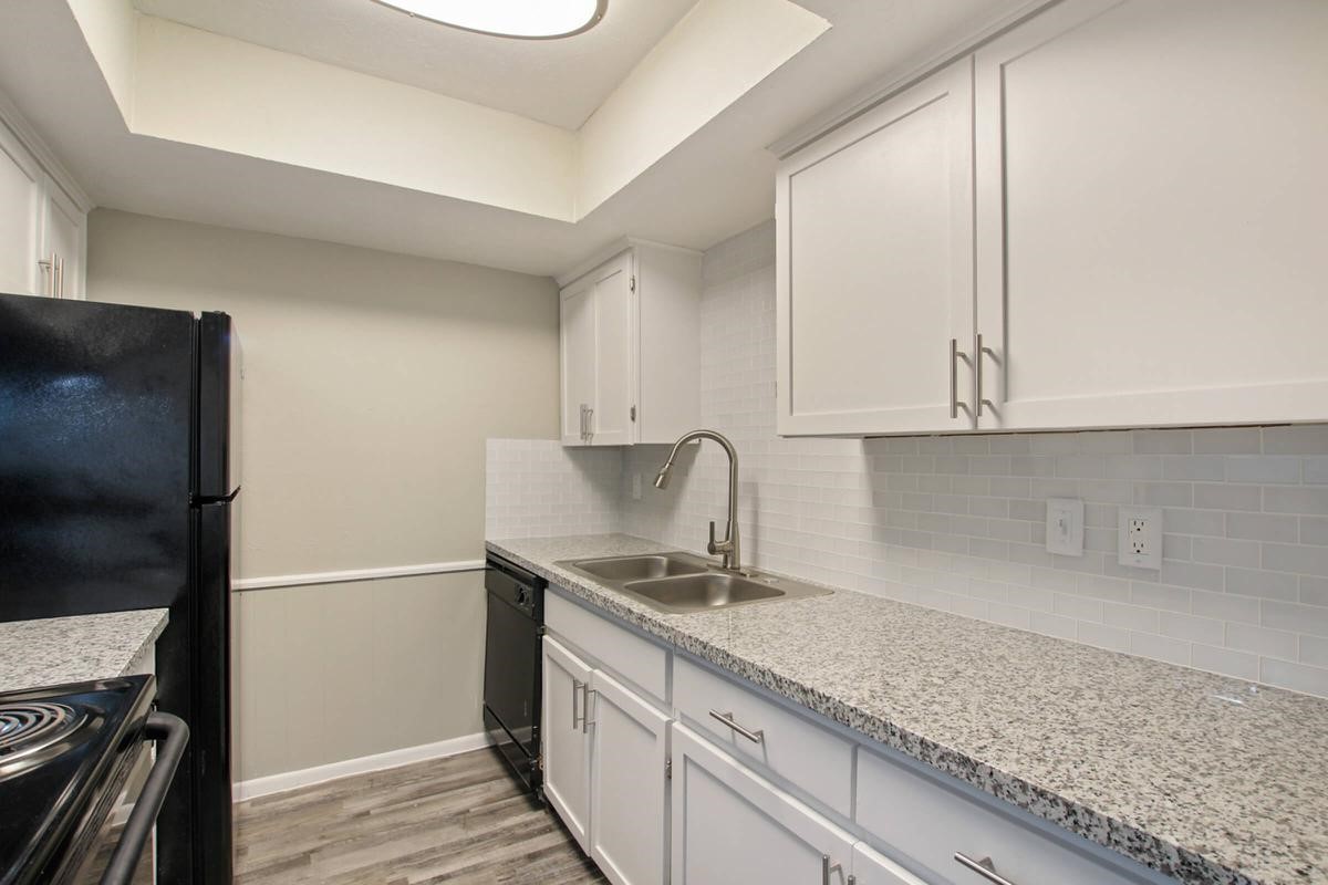 1212 Hampshire Lane, Unit 2371 Richardson, TX 75080 - Photo 4 of 50 a kitchen with granite countertop a sink stainless steel appliances and cabinets