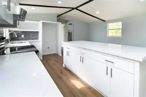 a view of a kitchen cabinets and a stove