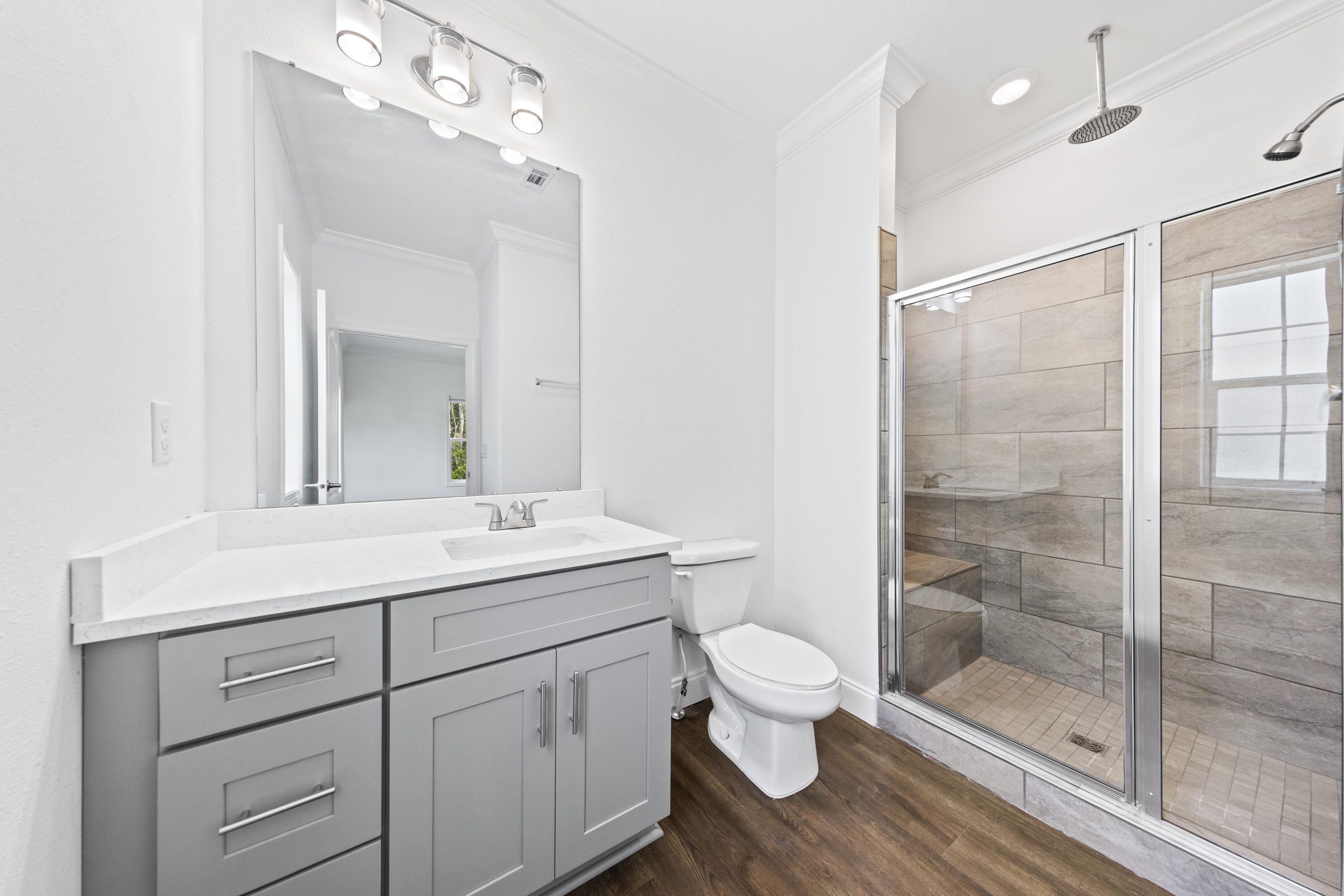 48 4th Street Santa Rosa Beach, FL 32459 - Photo 12 of 24 a bathroom with a sink a toilet and shower