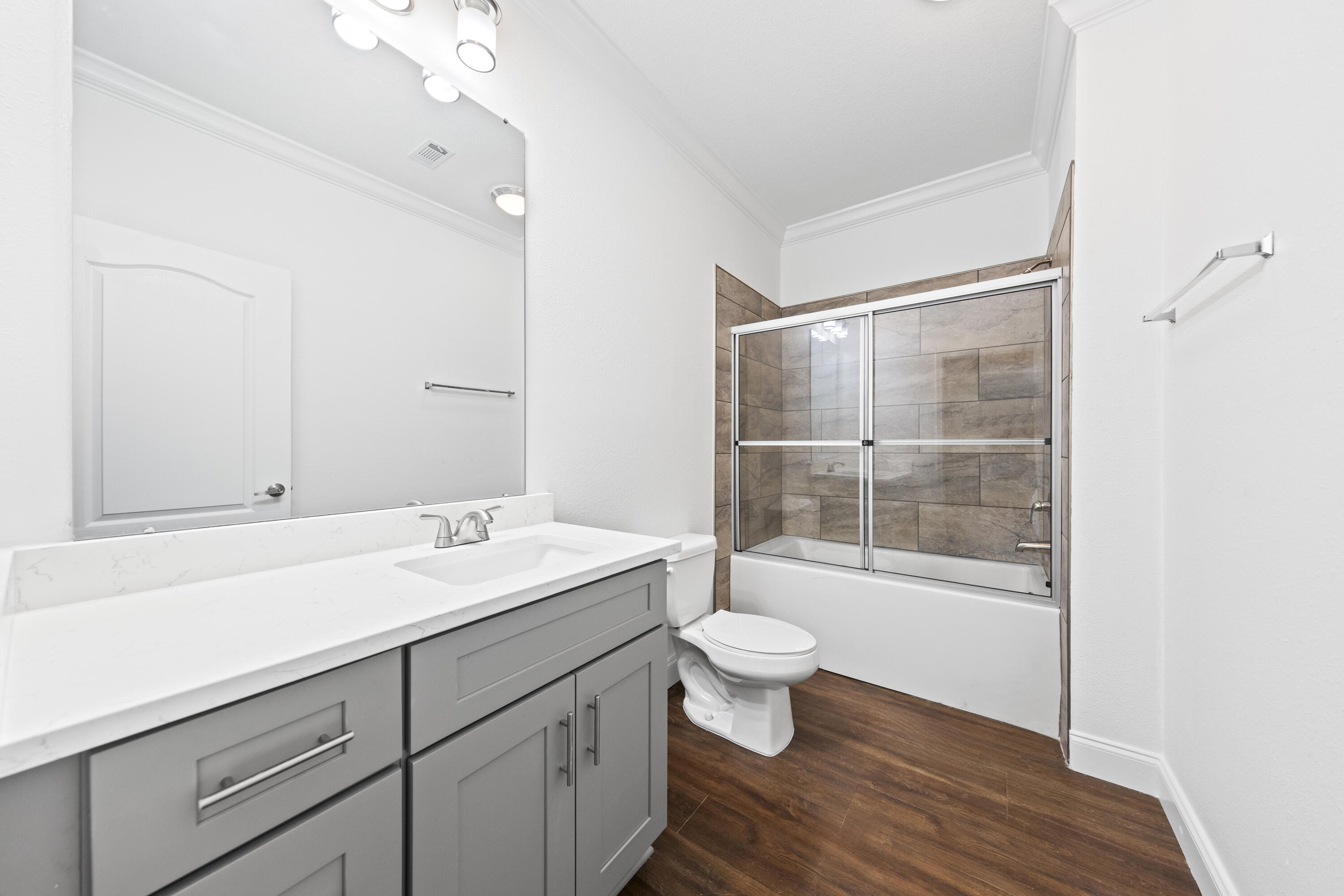 48 4th Street Santa Rosa Beach, FL 32459 - Photo 7 of 24 a bathroom with a sink toilet a mirror and shower