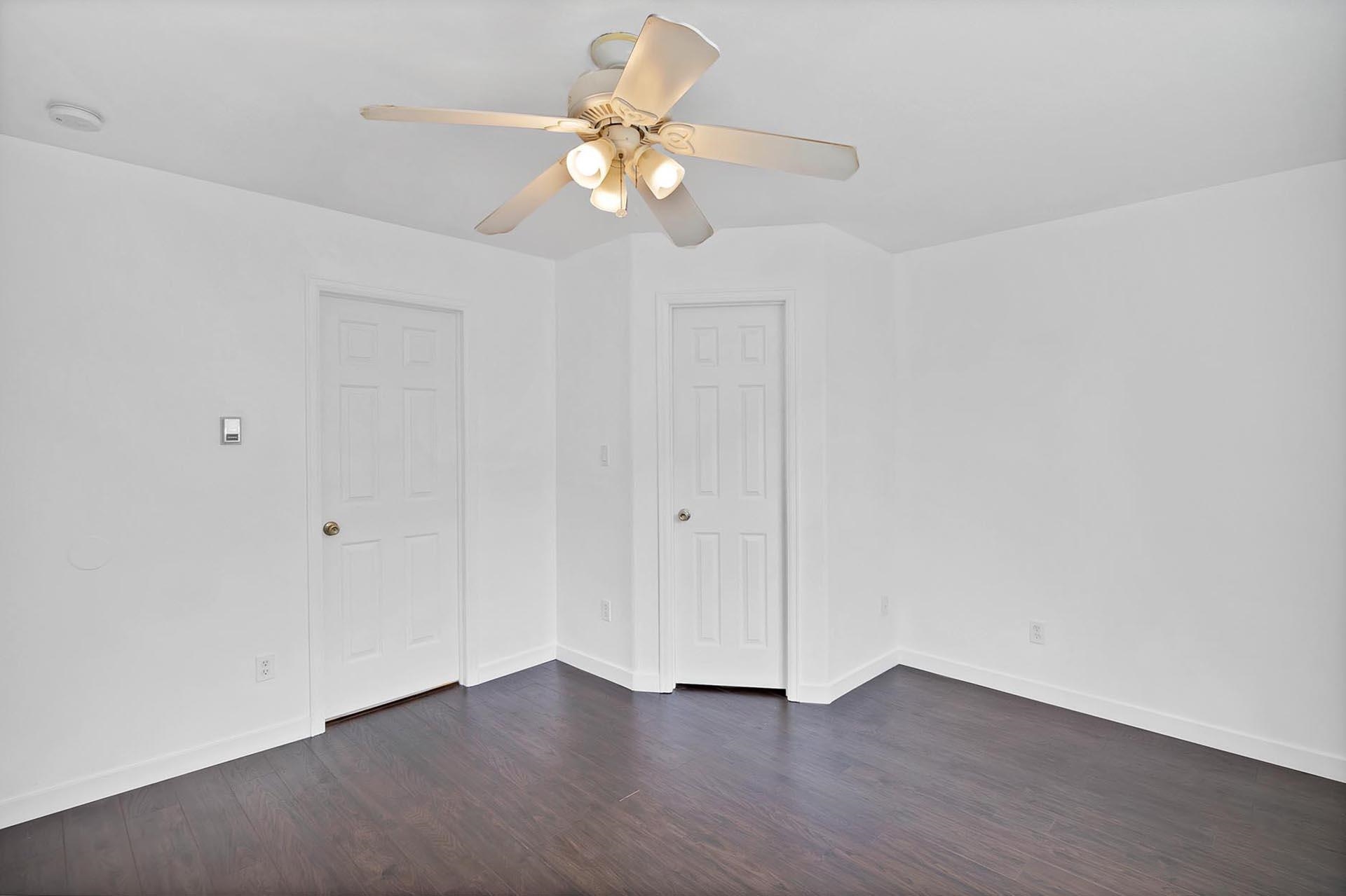 1124 Powell Street Fruita, CO 81521 - Photo 7 of 16 a view of an empty room with wooden floor