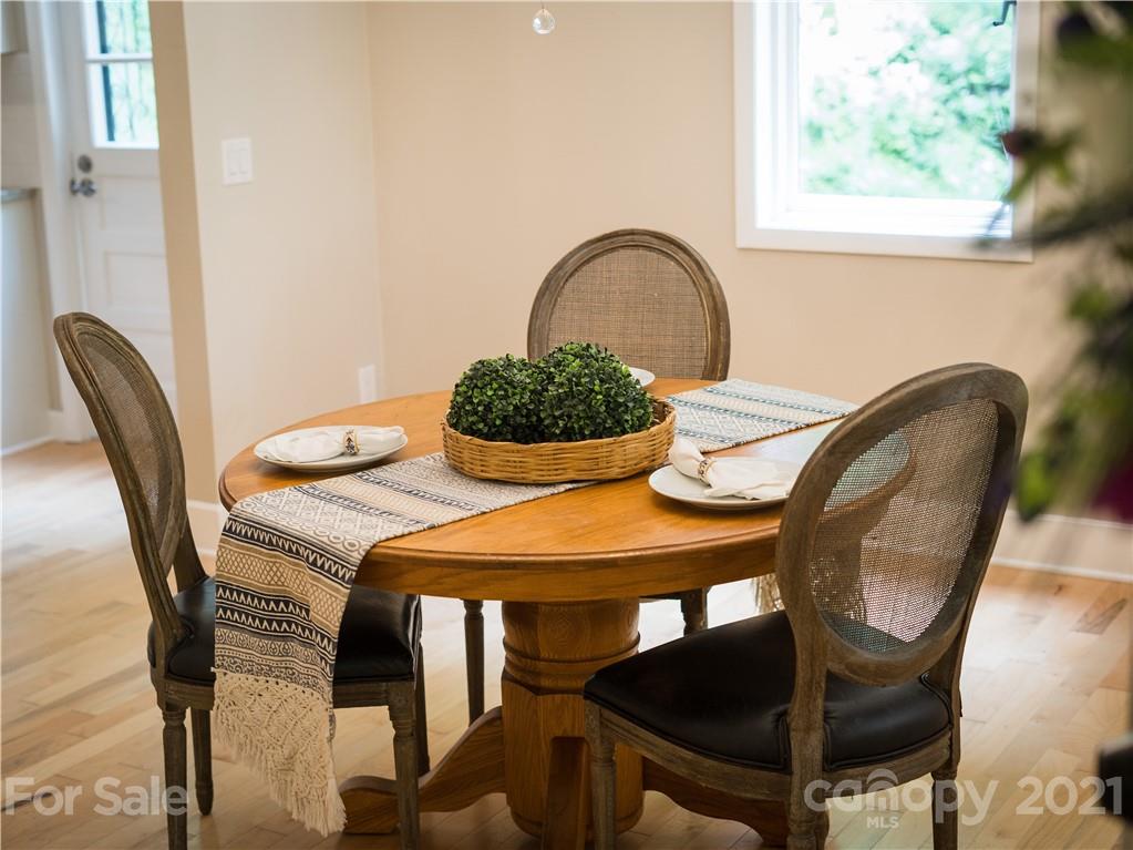 1778 Murray Road Canton, NC 28716 - Photo 14 of 42 a dining room with furniture window and wooden floor
