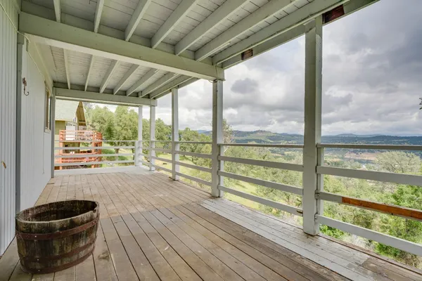 a room with wooden floor and furniture